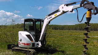 Аренда экскаватора погрузчика с ямобуром в Артем цена от 1554 руб